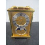 An Imhof swiss made carriage clock with moon phase and date aperture