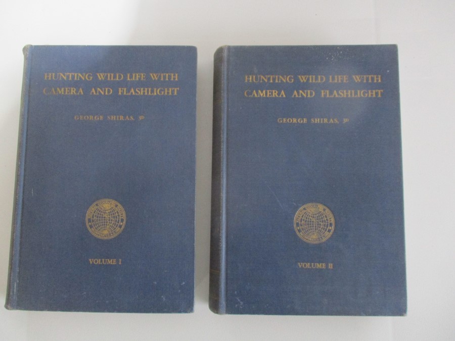 Two hardbacks "Hunting Wildlife with Camera and Flashlight" Volume one and two, by George Shirras.