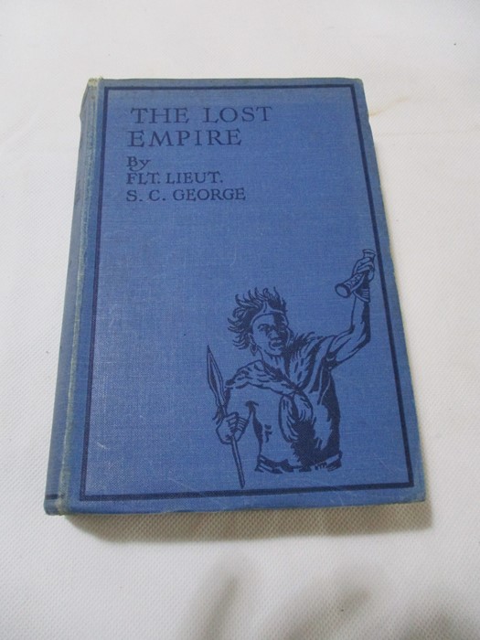 Hardback "The Lost Empire" by Flight Lieut. S.C. George. Bound in blue cloth with black lettering