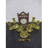 Two pairs of brass candlesticks, along with three brass chamber sticks, nutcracker and gothic mantle