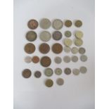 A small collection of various coins including silver