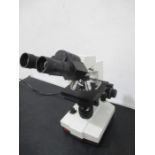 A laboratory binocular microscope