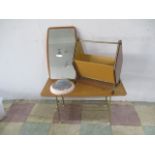 A collection of mid-century furniture including a small coffee table, magazine rack, hanging