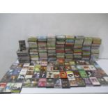 A collection of various music cassettes including Motorhead, Madonna, ABBA, Kenny Rogers, Kate Bush,