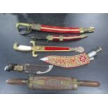 A collection of Indian and other daggers, a Swedish P.Holmberg knife in leather sheath etc