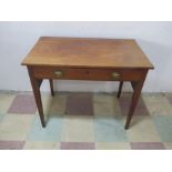 A mahogany writing desk with one drawer