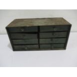 An industrial metal set of eight drawers