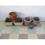 A collection of six various garden pots