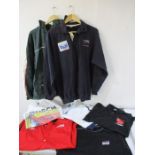 A collection of motorsport shirts and t-shirts.