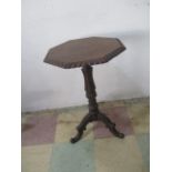 A Victorian oak occasional table with octogen top and tripod base