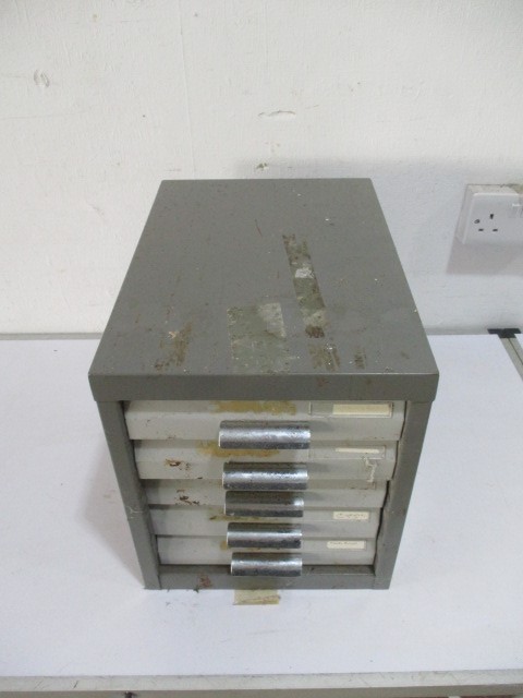 An industrial set of filing drawers