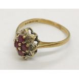 A 9ct gold ruby and diamond cocktail ring. Size M