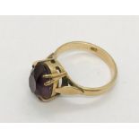 A 9ct gold ring set with an amethyst. Size N1/2