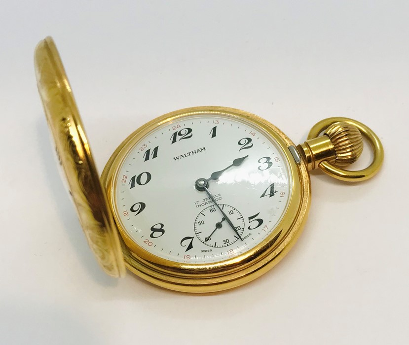 A gold plated half hunter pocket watch, the white enamelled dial with subsidiary second dial, marked