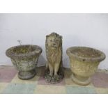 A reconstituted stone lion along with two garden pots