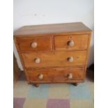 A pine chest of four drawers