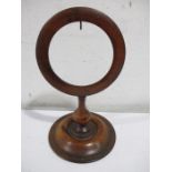 A treen watch stand with turned stem and base, height approx 23cm