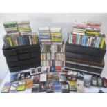 A large collection of music cassettes including Led Zeppelin, U2, George Michael, Dire Straits,