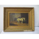 An unsigned Victorian oil on canvas of two horses in a stable in gilt frame (A/F) loose pieces of