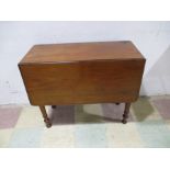 A Victorian mahogany drop leaf table