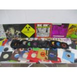 A collection of 7" vinyl singles including The Rolling Stones, Pink Floyd, Elvis Costello, ELO, Paul