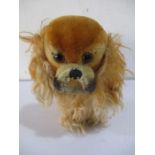 A Steiff Pekinese dog with moveable head, yellow tag and button to ear