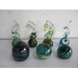 A collection of seven Mdina glass paperweights including seahorses