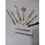 A collection of assorted items including silver handles cutlery, thimbles, letter openers, horn