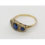A 9ct gold ring with simulated sapphires and diamonds