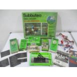 A boxed Subbuteo table soccer club edition set, along with accessories including stadium scoreboard,