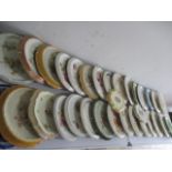 A large collection of bread plates with wall hangings