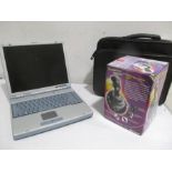 An Atlas Flyer 3400 laptop and SideWinder Joystick