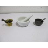Three mortar and pestle, brass, pewter and porcelain