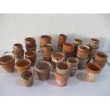 A collection of small terracotta plant pots- some A/F