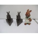 A pair of mice bookends, along with a pottery rabbit