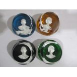 A set of four Baccarat royal cameo paperweight including Queen Elizabeth II, Duke of Edinburgh,