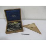 An oak cased Stanley drawing set along with a SCM S.Mordan & Co pen etc.