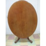 A Victorian oval tip up table, stamped BWC 7466 to underside. along with retailers label