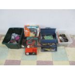 A collection of various power tools and accessories including a Black and Decker corded drill and