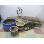 An assortment of garden troughs, pots etc