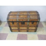 A wooden metal bound dome topped trunk