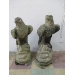 A pair of concrete eagles on plinths, 70cm height