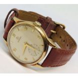 A gentleman's 9ct gold Omega mechanical wristwatch with subsidiary dial. Original 9ct gold buckle.