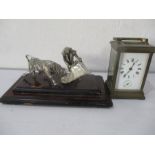 A French brass carriage clock ( one glass panel missing) along with a white metal group of a