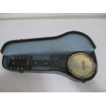 A British Made banjo in carry case