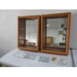 Two mirror backed display cabinets with glass shelving