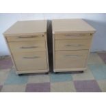 A pair of beech effect filing cabinets