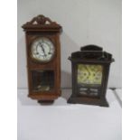 A P.Watts & Son wall hanging clock, along with a wooden mantle clock