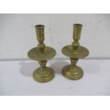 A pair of brass candlesticks