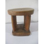 An African tribal stool with square base
